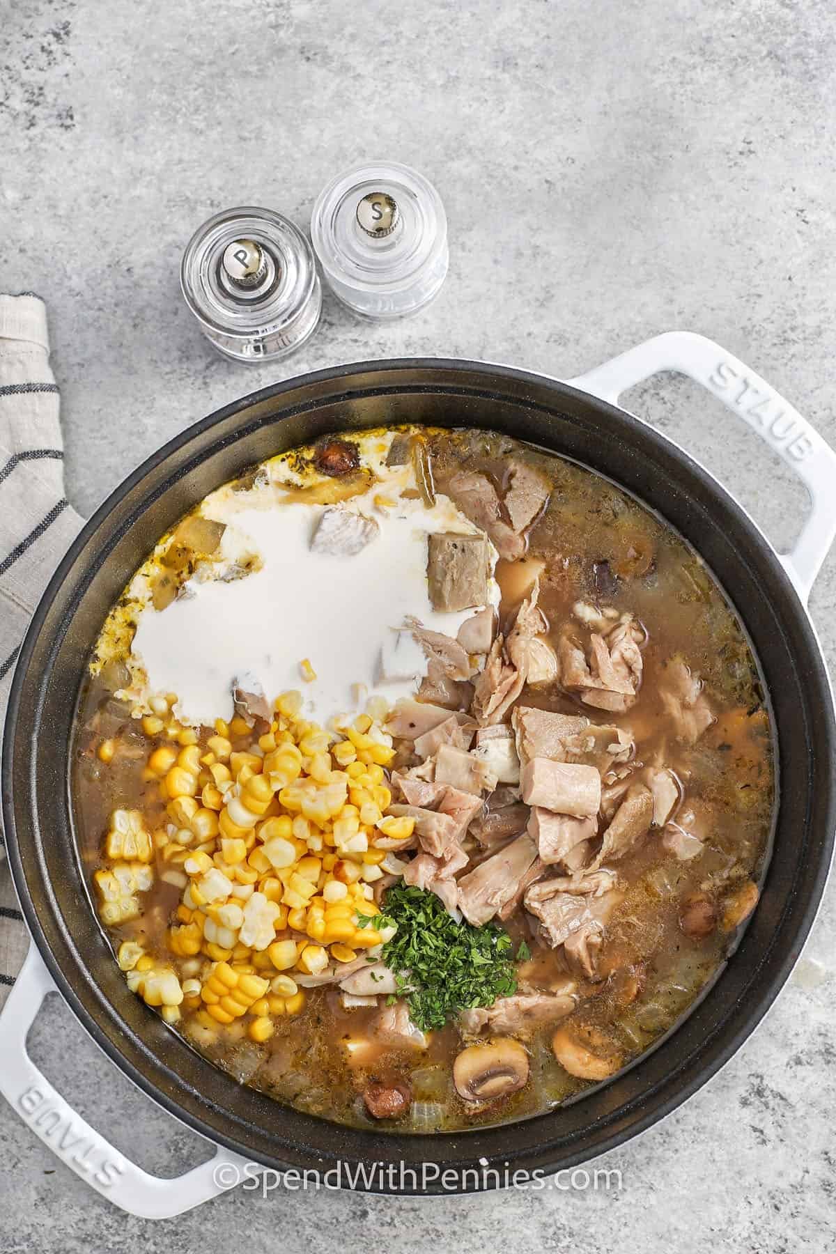 adding chicken , cream , corn to pot to make Chicken Wild Rice Soup