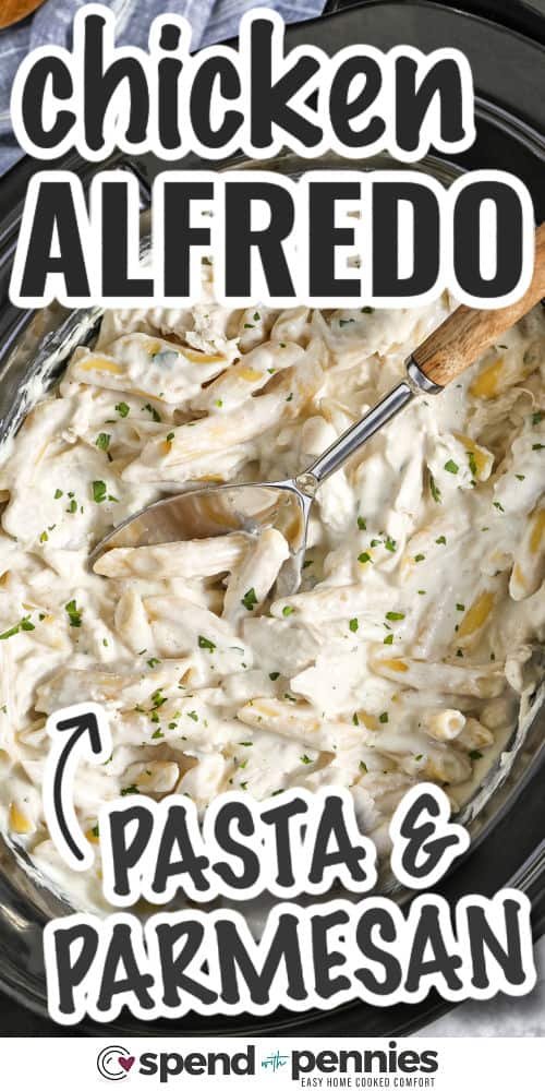 cooked Crock Pot Chicken Alfredo in the pot with a spoon and writing