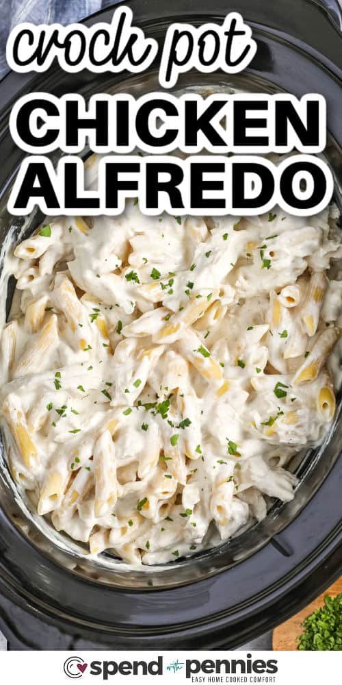 creamy Crock Pot Chicken Alfredo in the pot with writing