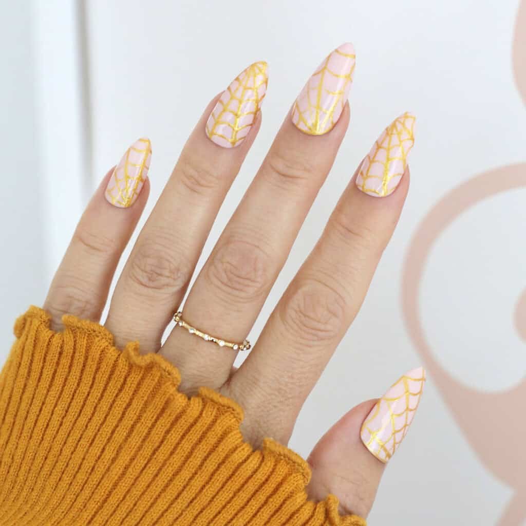 gold spider web halloween nails