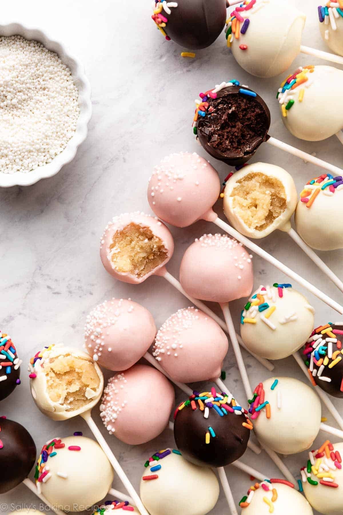 homemade chocolate, vanilla, and pink cake pops.