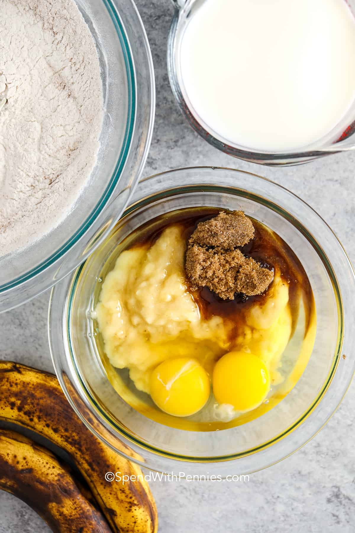 eggs, bananas, sugar and oil in a bowl for banana pancakes